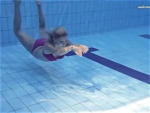 warm Elena showcases what she can do under water